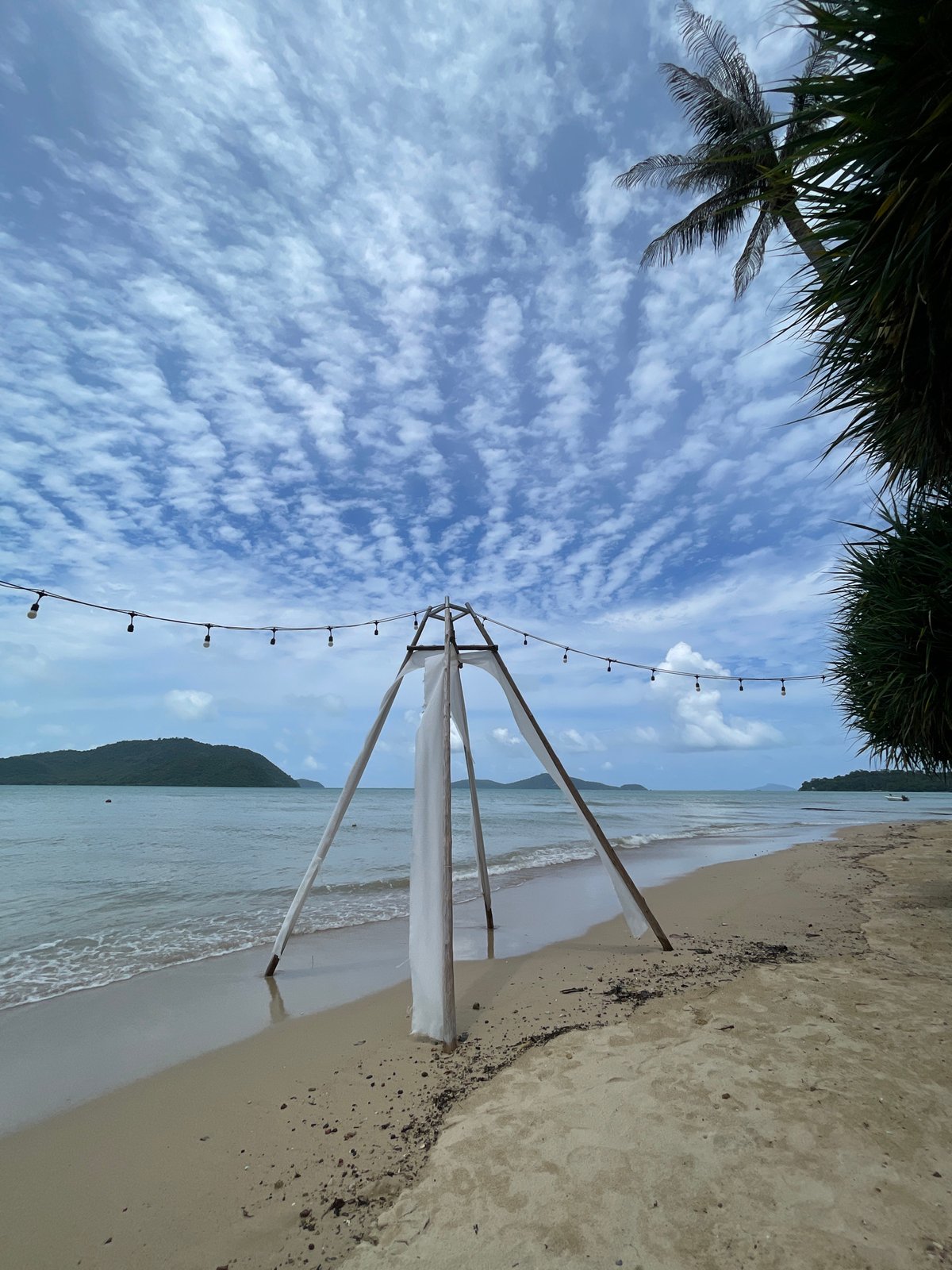 White fabric canopies and archway set up on Rawai beach