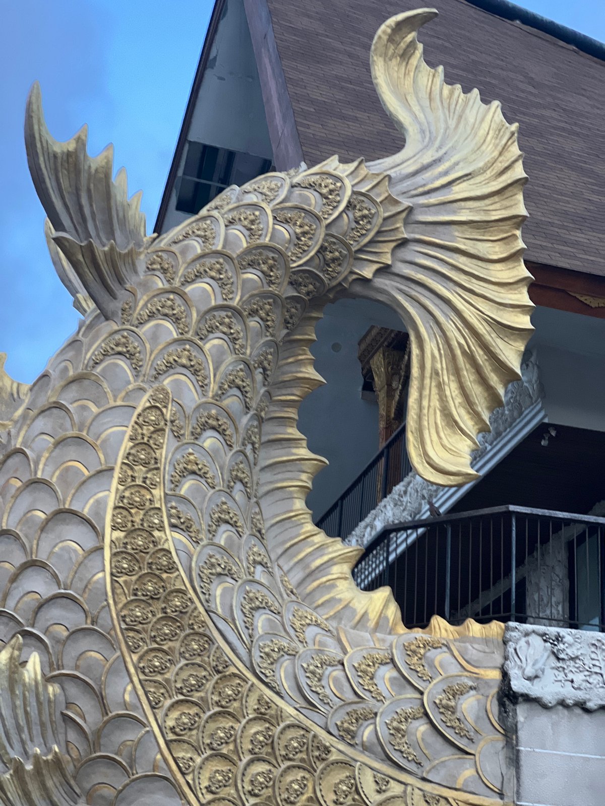 Witness documents waterside building with mythical sculptures in Denpasar