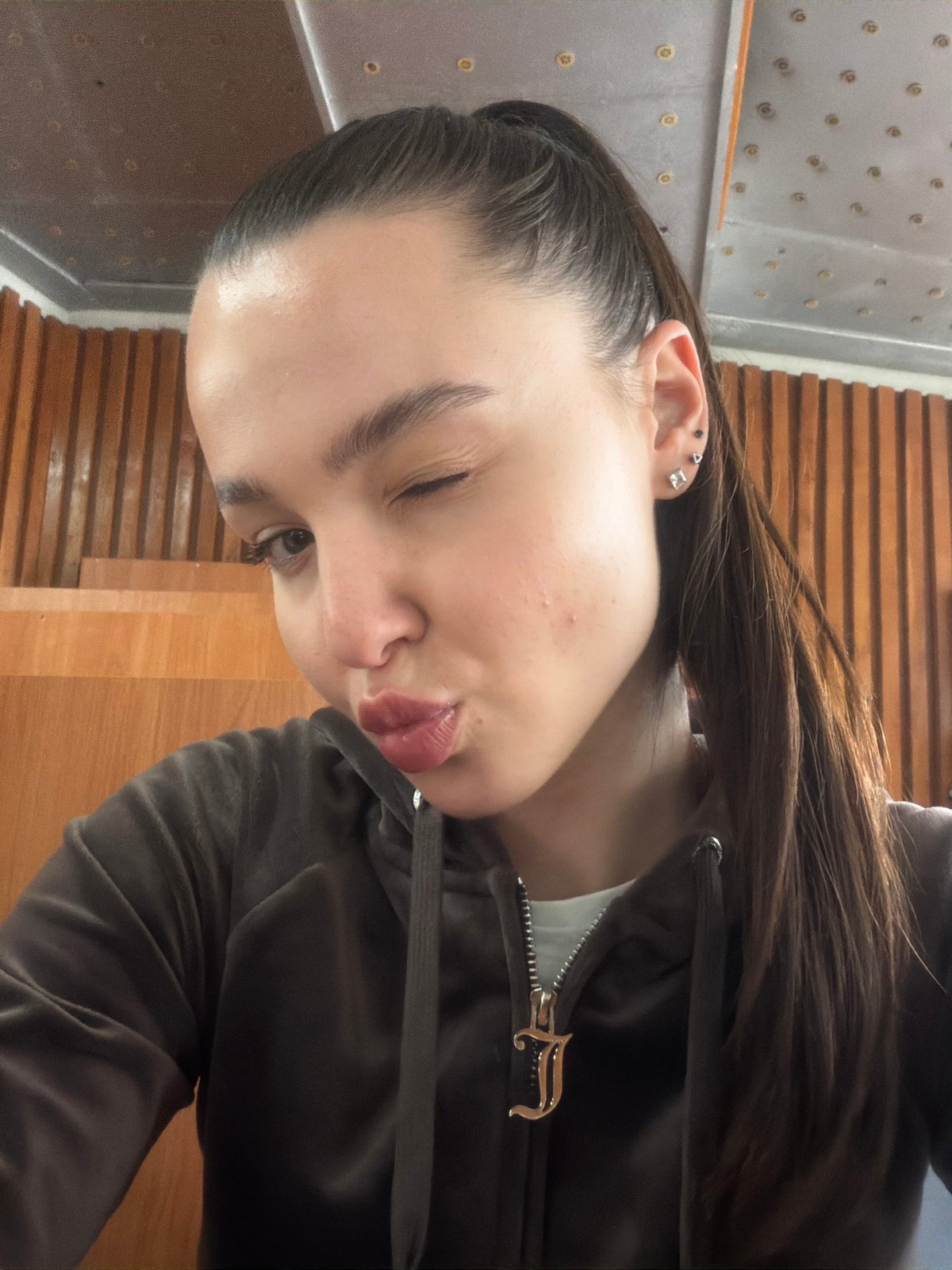 Young woman takes multiple selfies during afternoon in Sofia