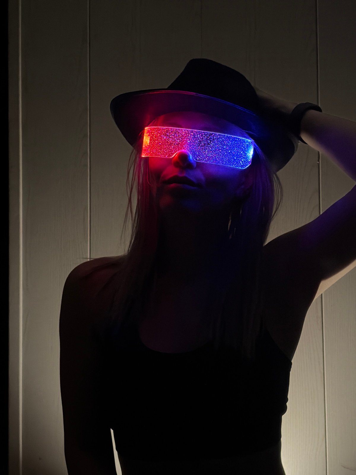 Woman poses with sunglasses-wearing cat in Chaikovsky home