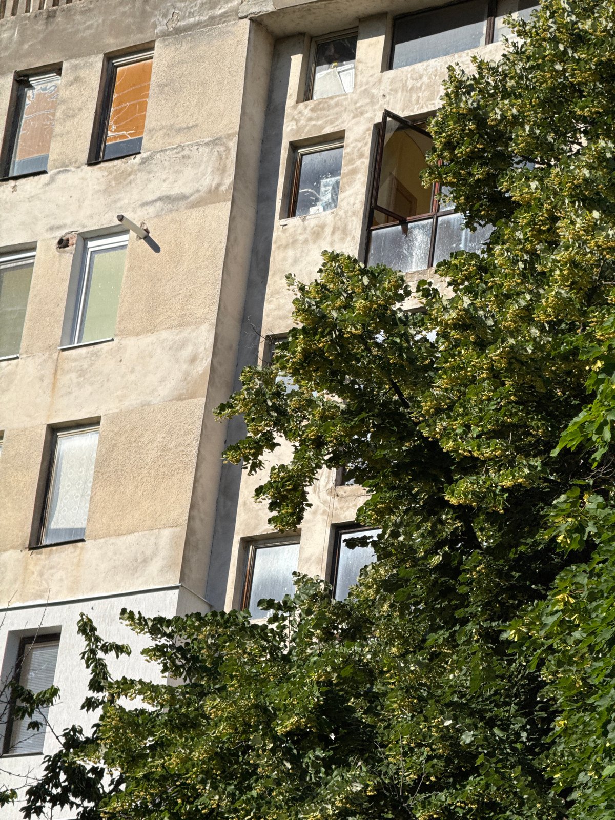 Weathered concrete building facade in Lovech, Bulgaria