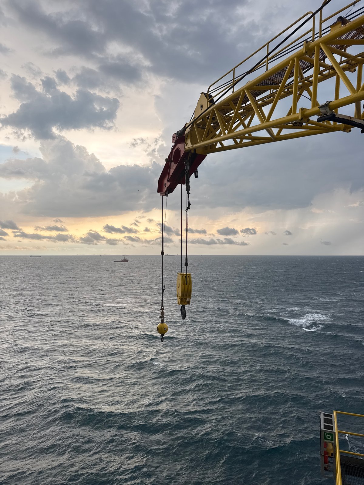 Crane vessel works near offshore platforms in Italian waters