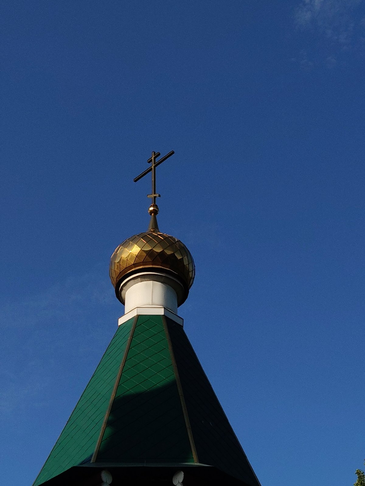 Afternoon scenes captured around wooden church with golden domes