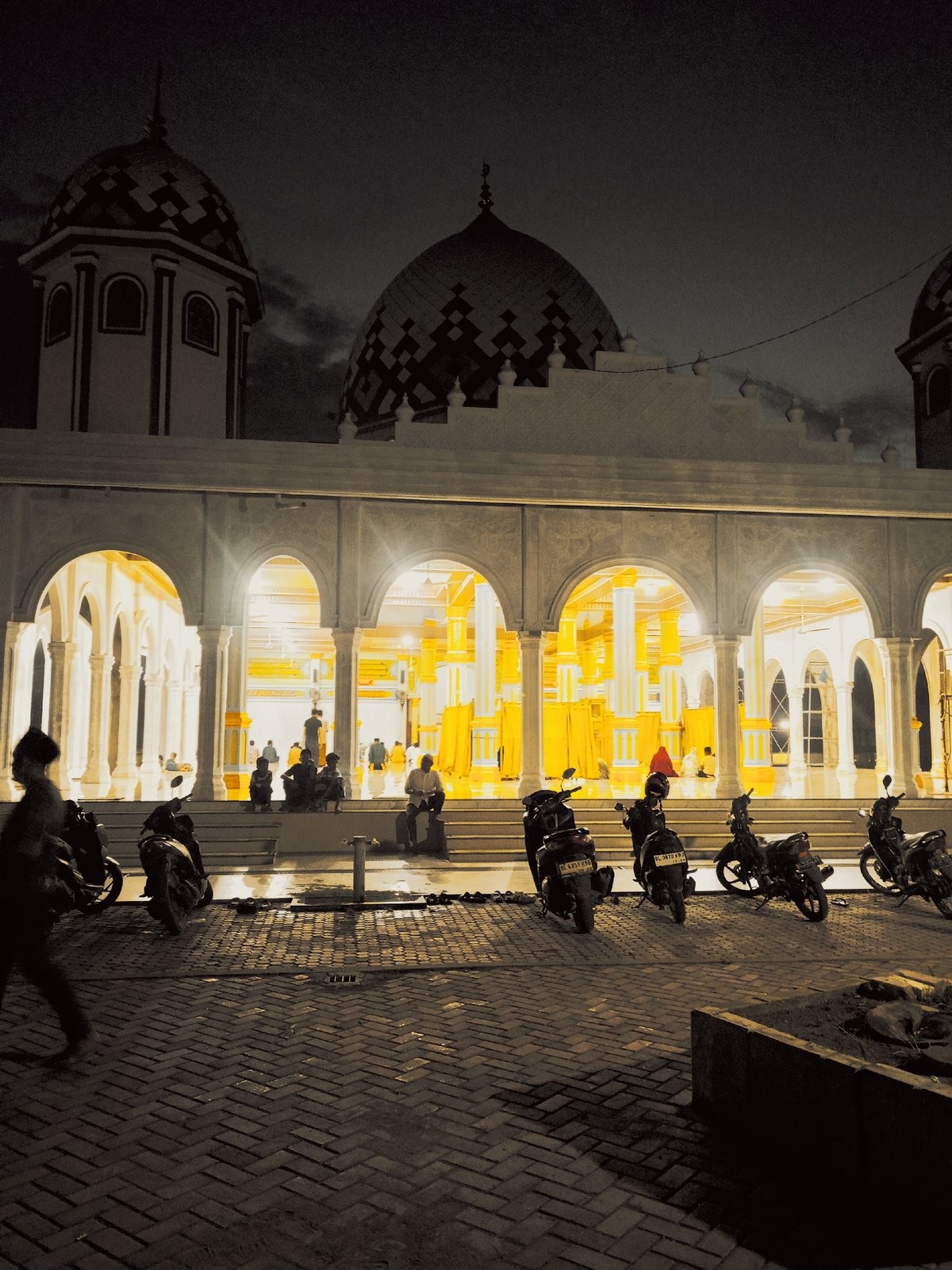 Nighttime scenes captured at Baiturrahman Mosque in Meunasahlhok, Indonesia