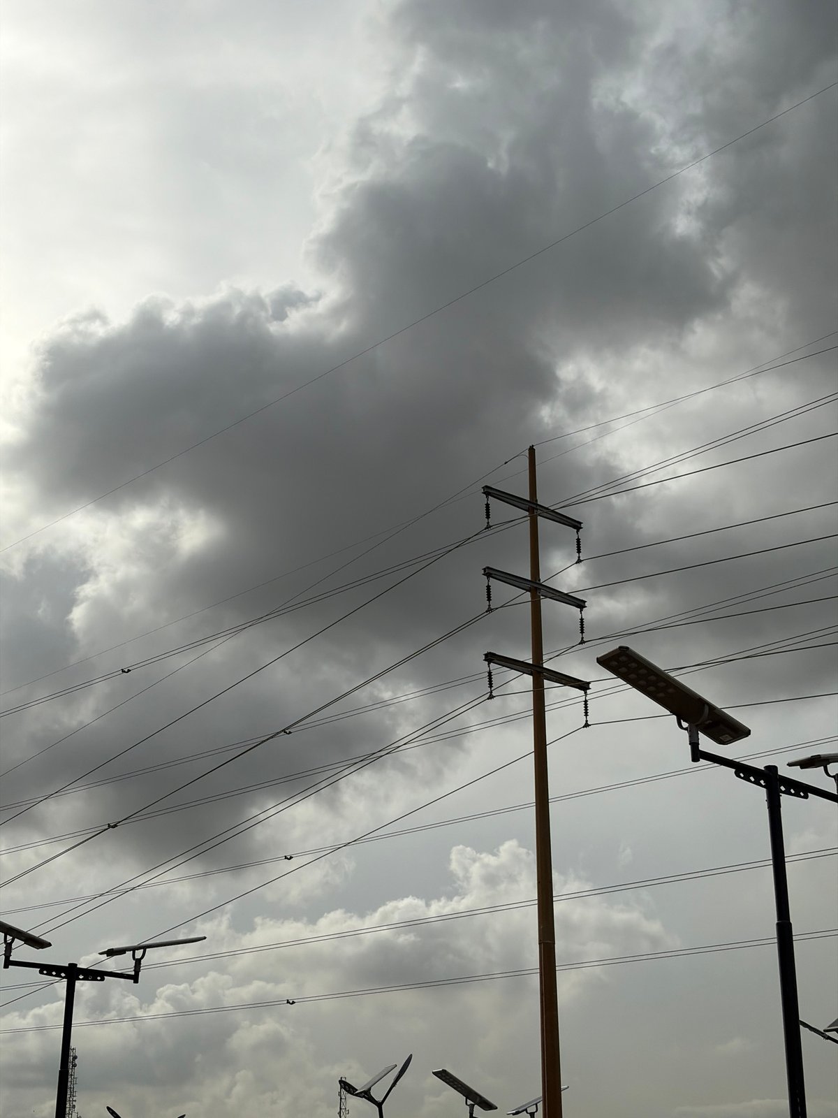 Power lines documented under overcast skies in Igboefon, Nigeria