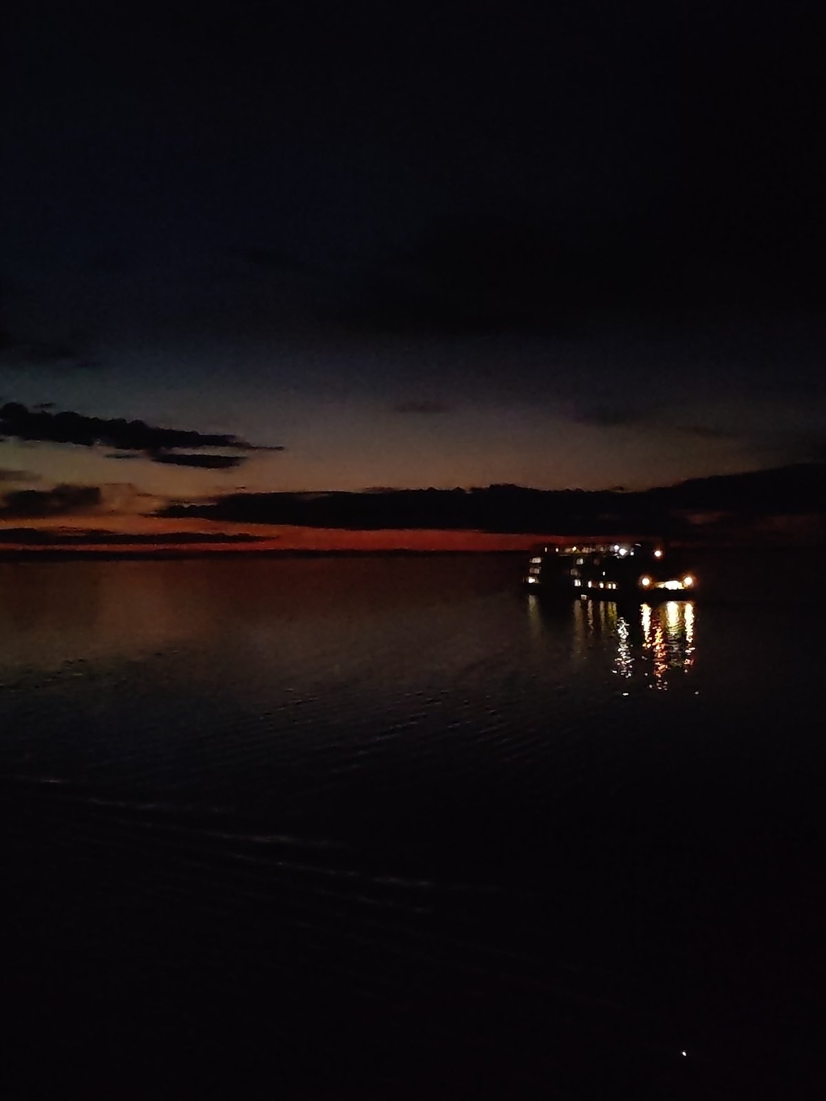 Tourist boat spotted at night over submerged Russian town