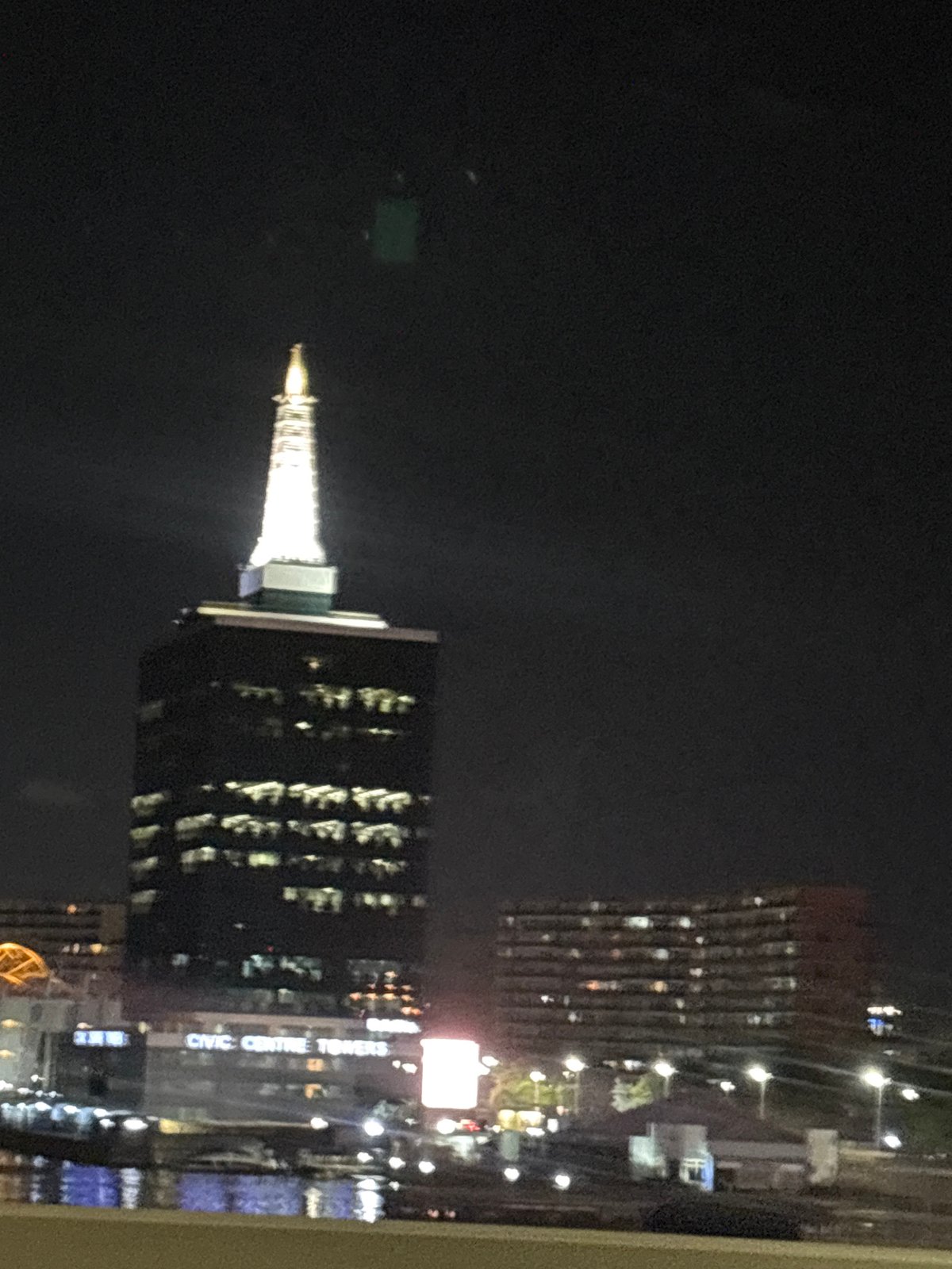 Ikoyi's Civic Centre Towers illuminated in evening cityscape