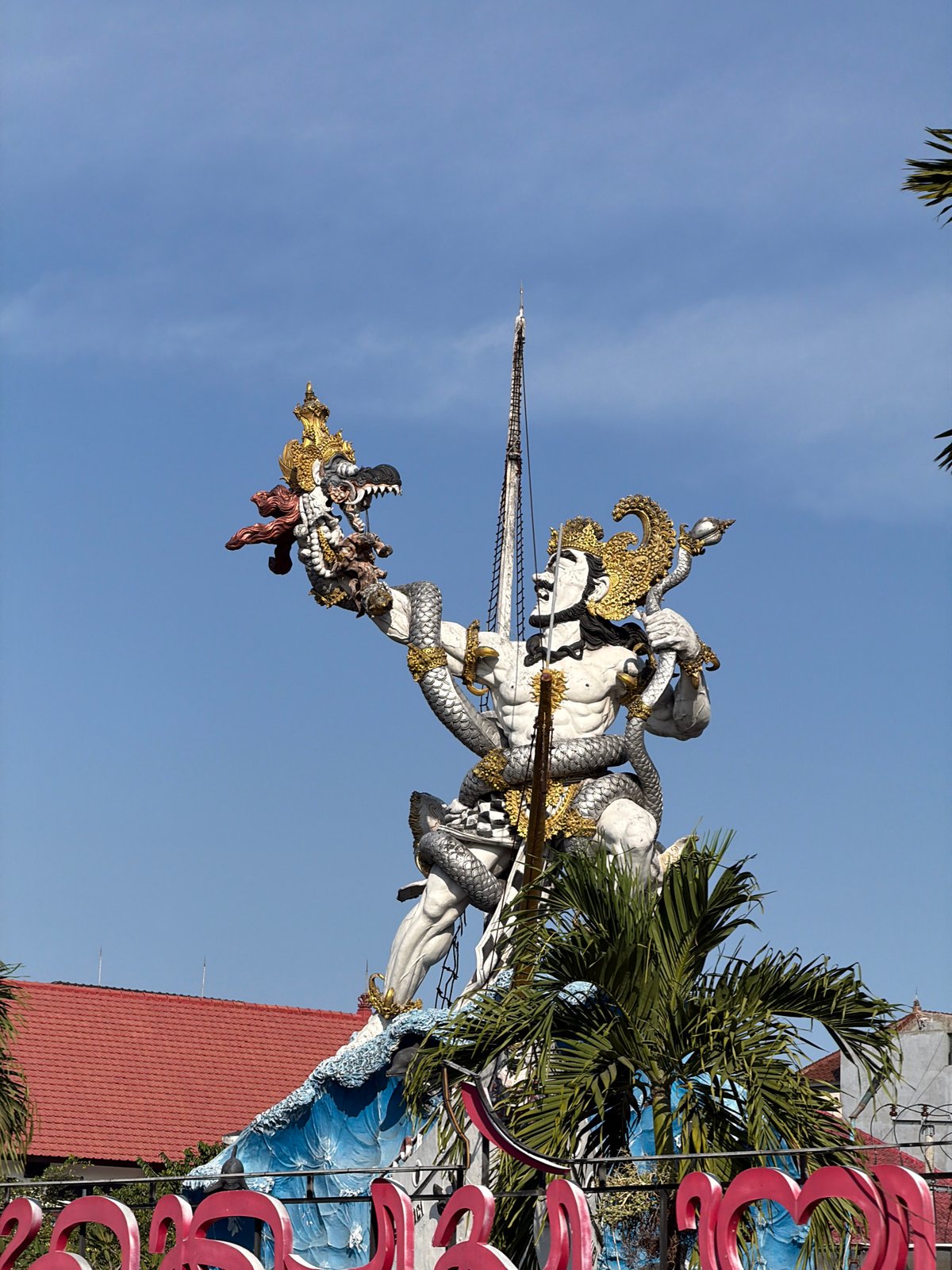 Two angles on Bali's iconic GWK statue at dawn