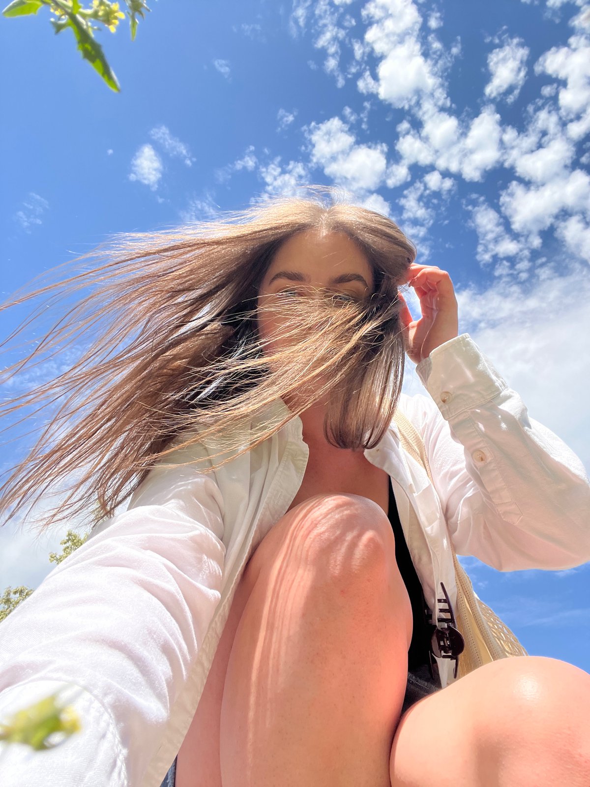 Woman photographed against cloudy sky in Ternopil, Ukraine