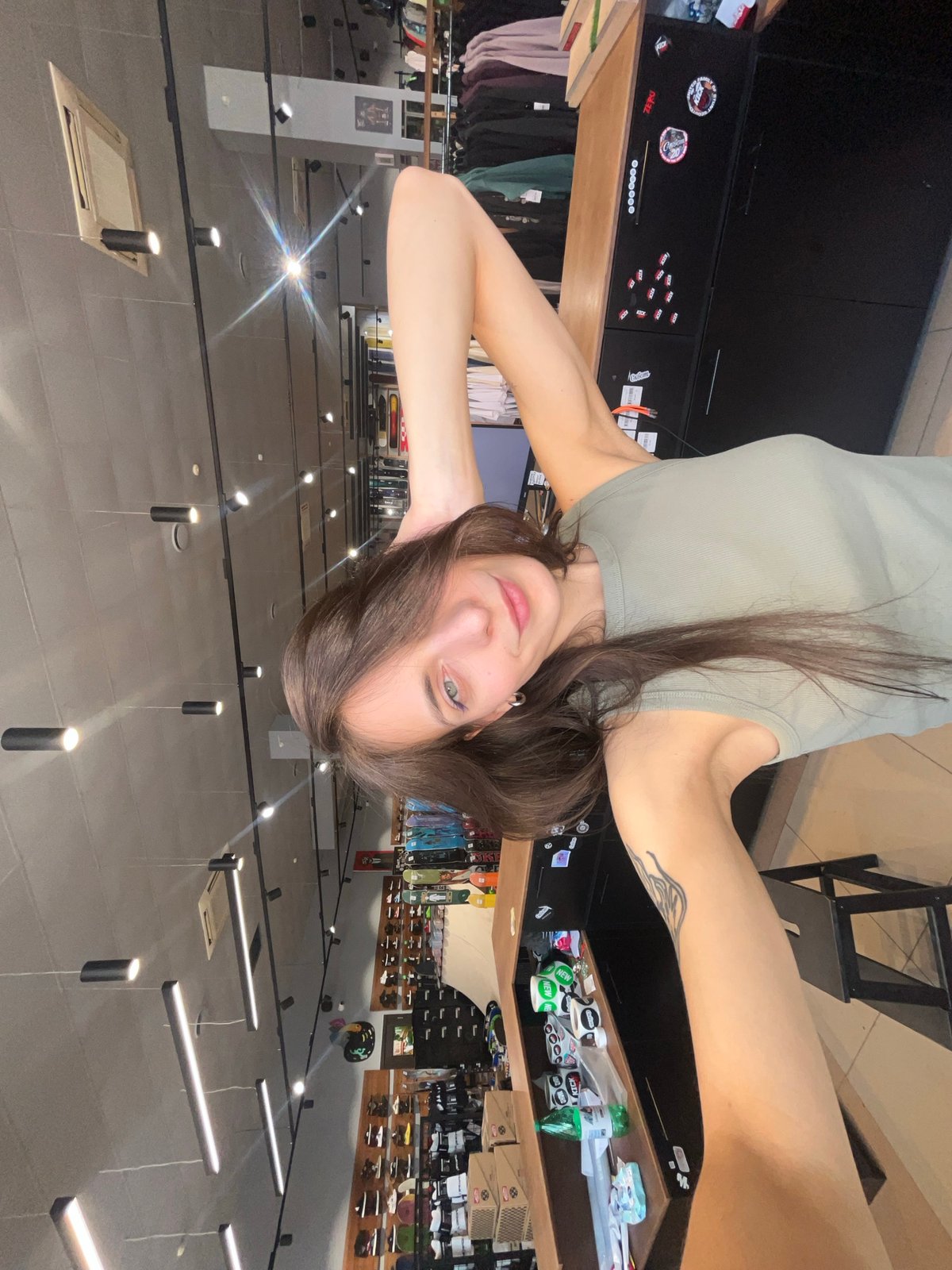 Woman takes playful selfies in Krasnoyarsk clothing store