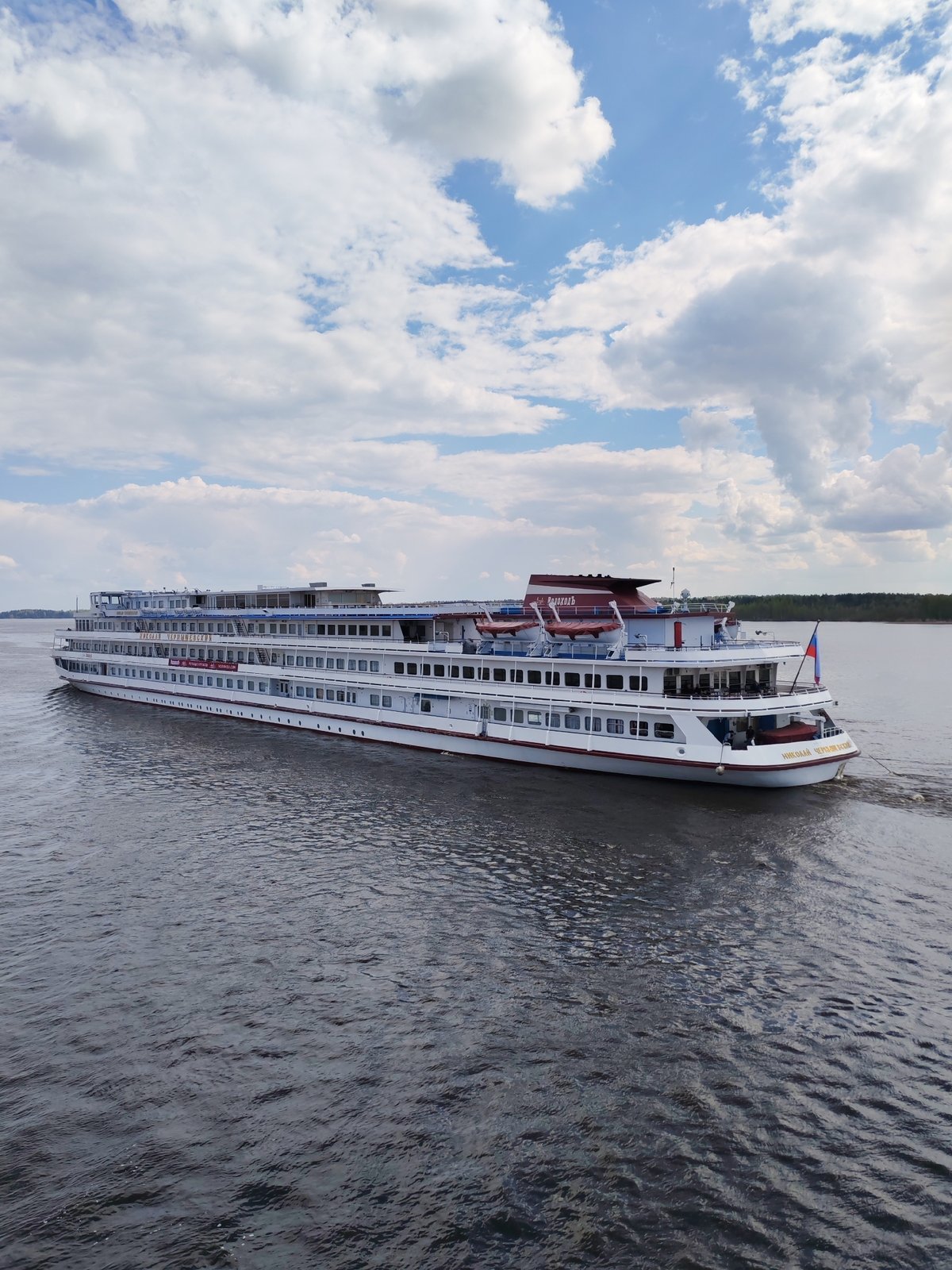 River traffic observed near Pruzhinino includes cruise ships, cargo barge