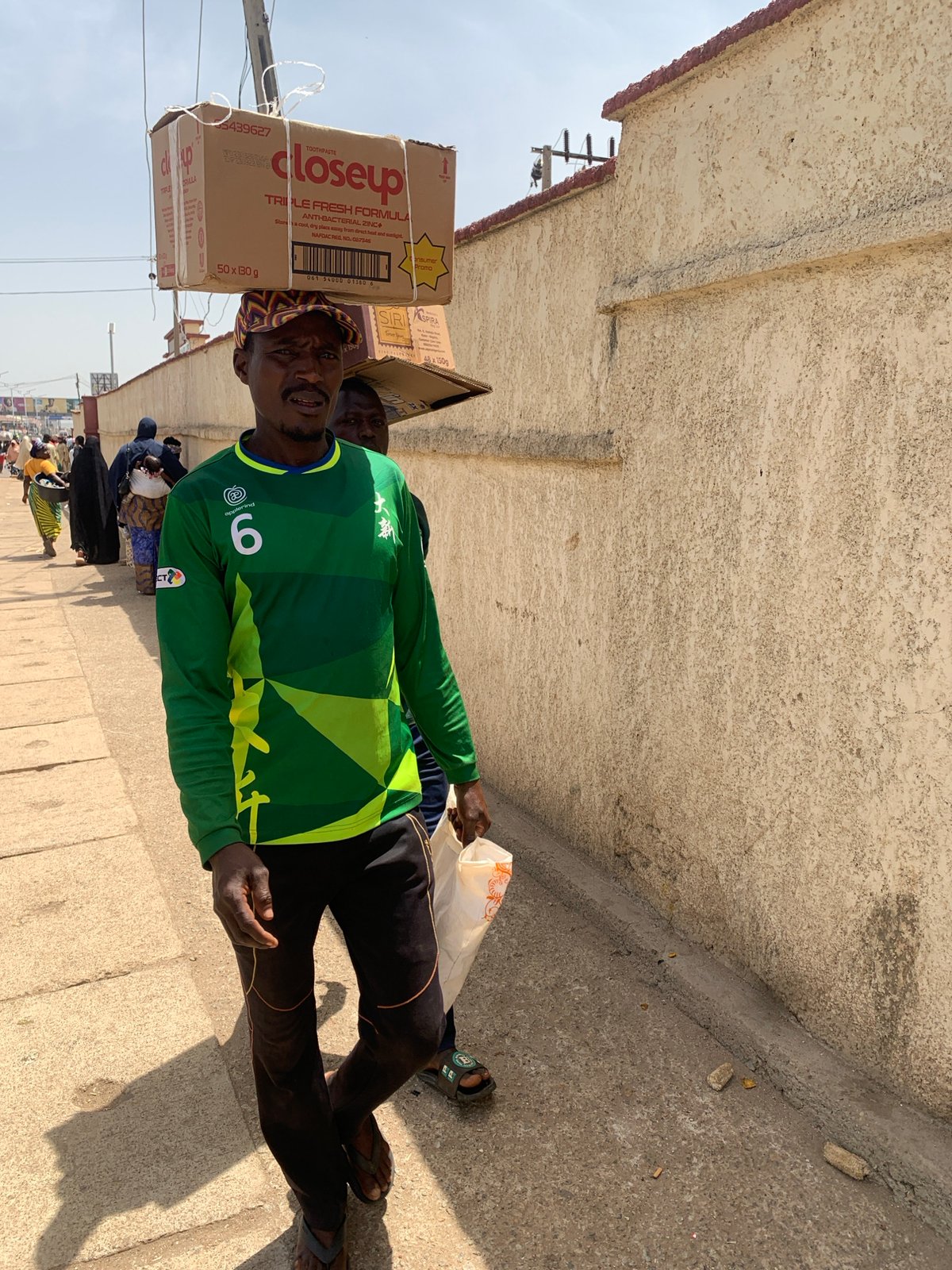 Daily street commerce and community life documented in Jos