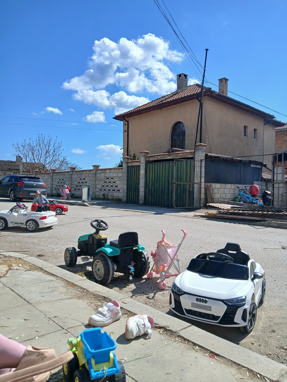 Children play with toys, devices in Bulgarian village afternoon