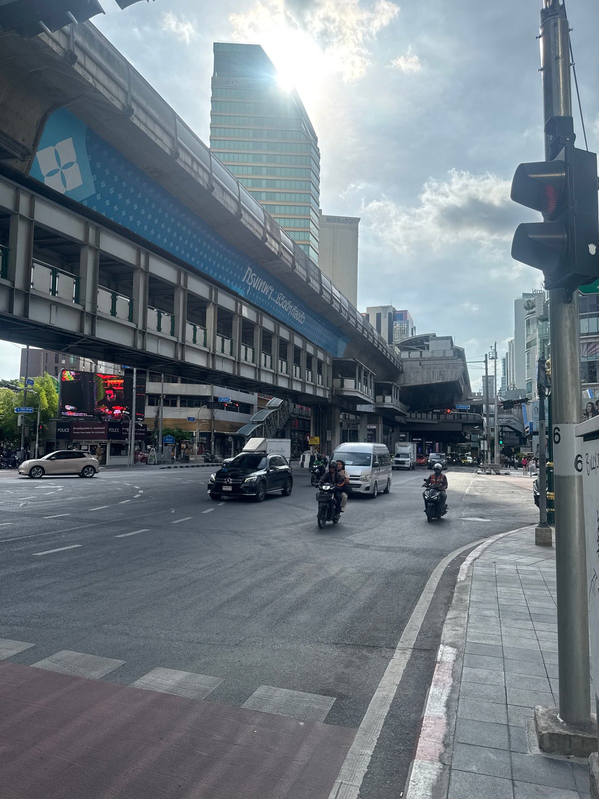 Bangkok street scene captures BTS Skytrain and urban infrastructure