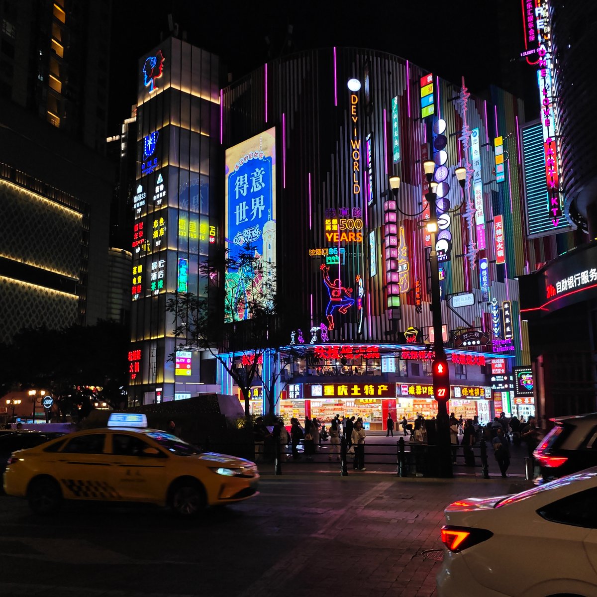 Cultural exhibition and neon-lit streets captured in Yuzhong District