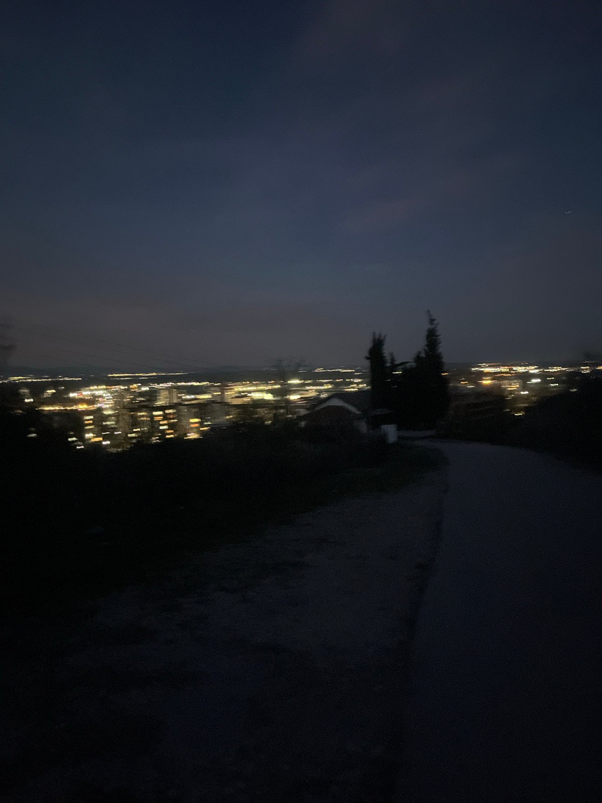 Nighttime cityscape view captured over illuminated Asenovgrad, Bulgaria