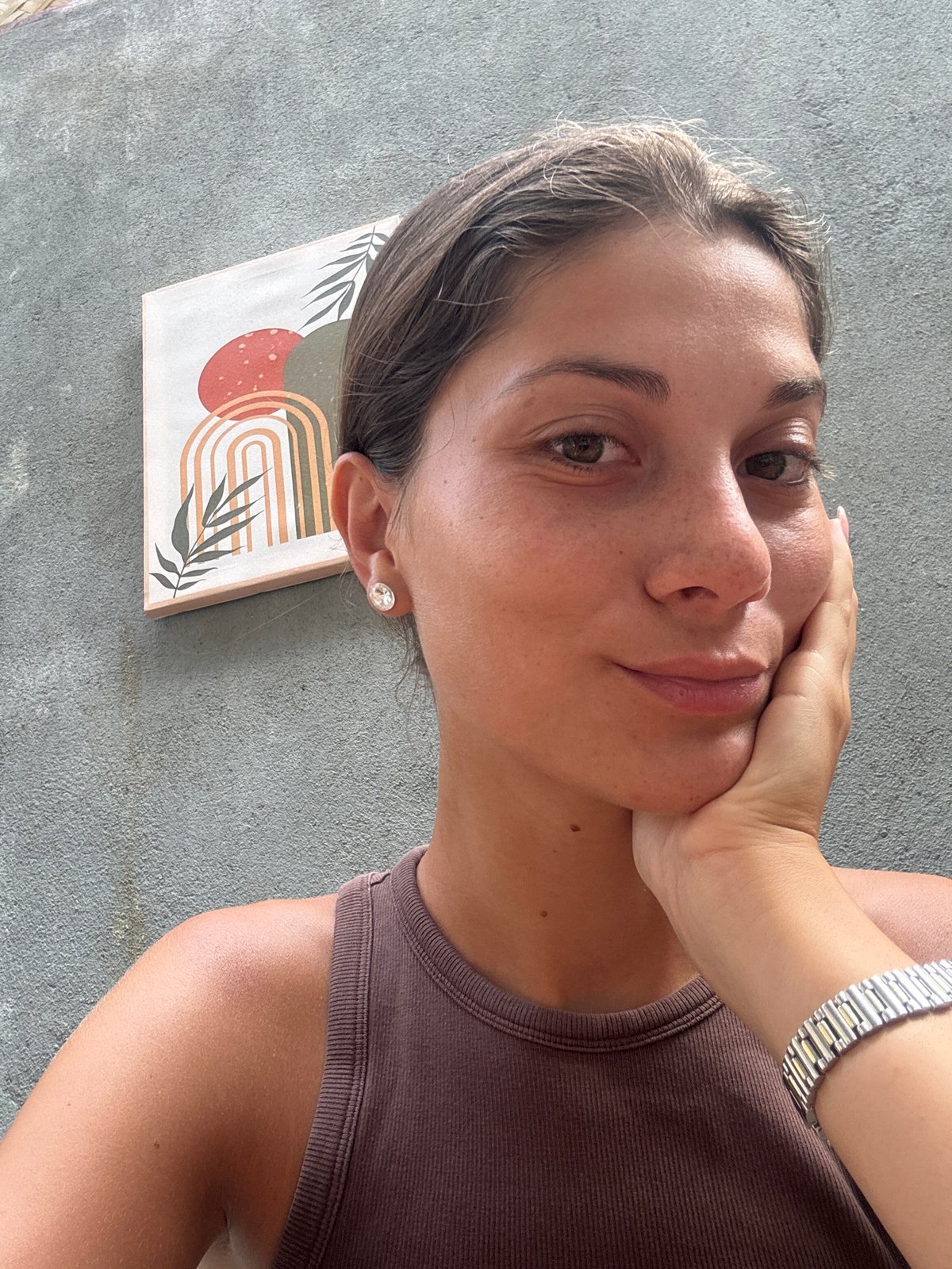 Woman documents smoothie bowl breakfast in Đà Nẵng cafe