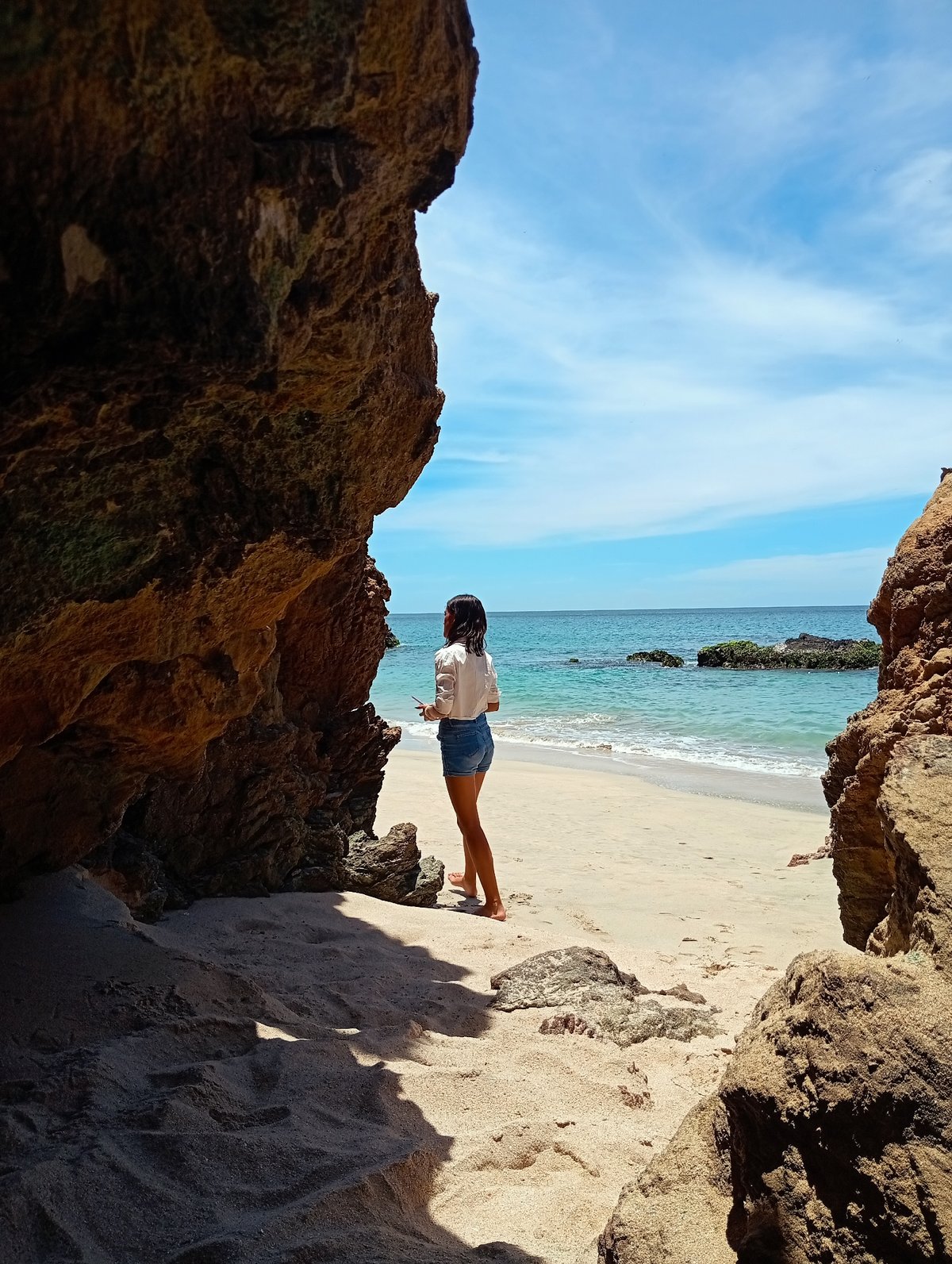 Woman enjoys quiet moment at Venezuelan Caribbean beach