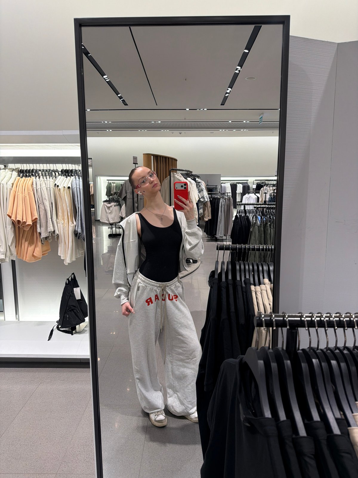 Person Takes Mirror Selfie in Khimki Clothing Store