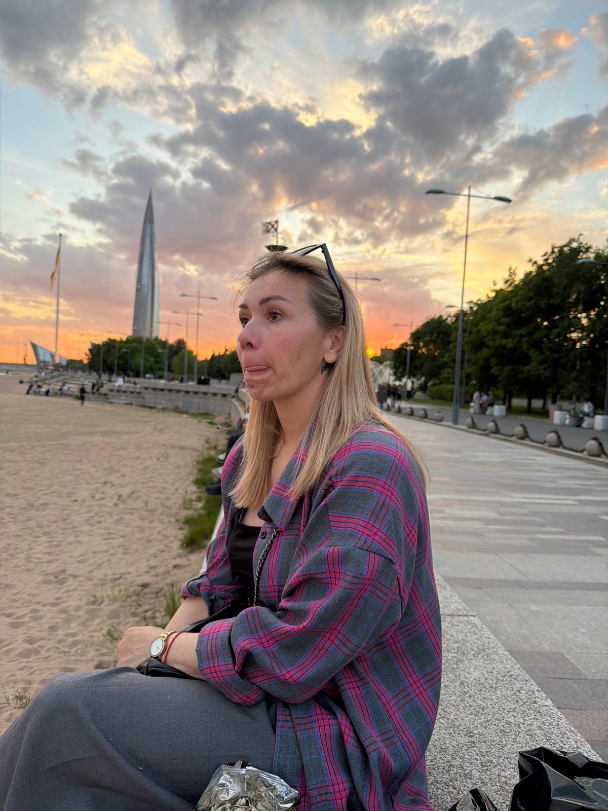Woman photographed in contemplative moments during sunset in Saint Petersburg