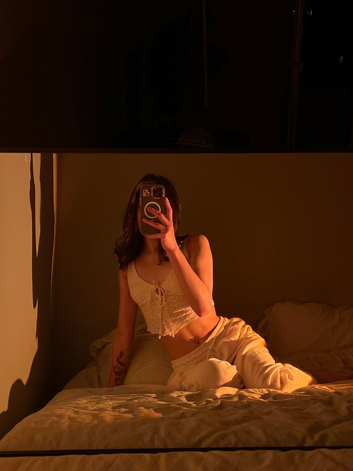 Person takes bedroom selfies in Ternopil during evening hours