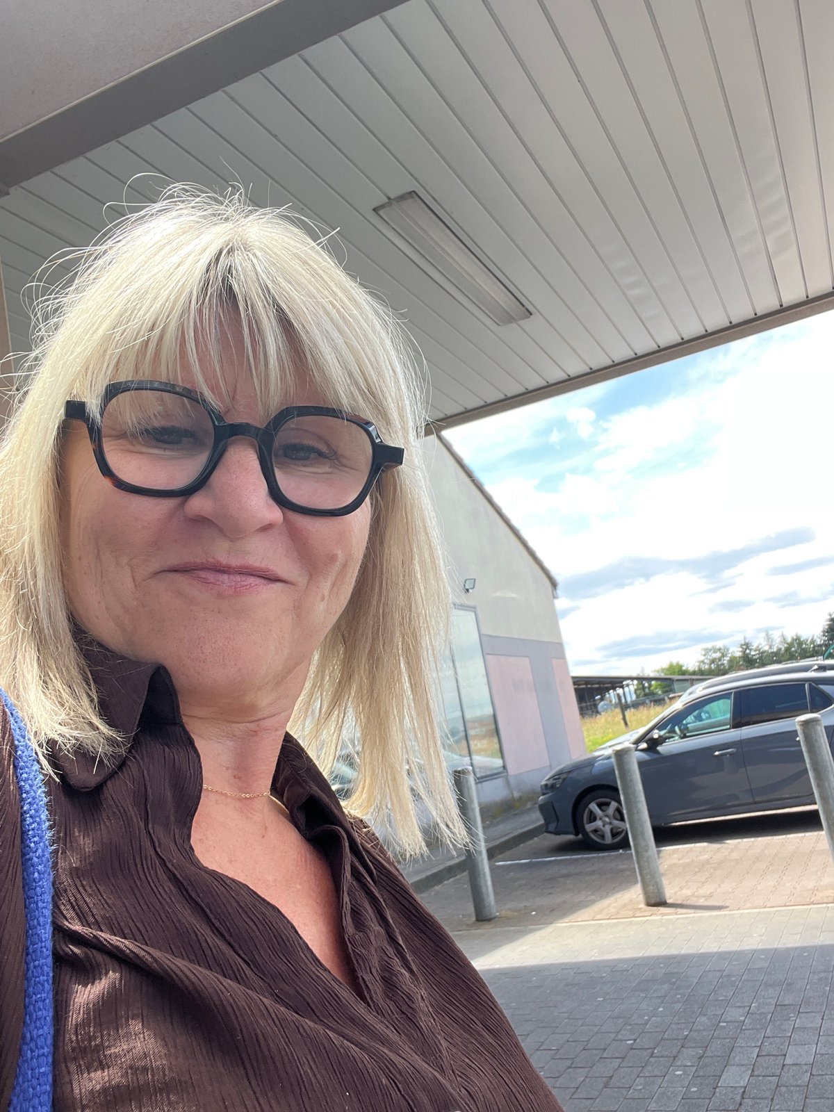 Woman takes selfie in Saint-Galmier, France