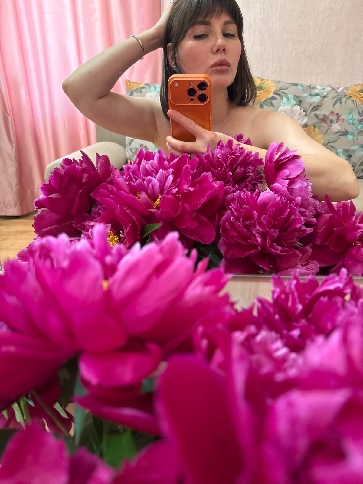Woman documents leisurely afternoon with peonies and river activities