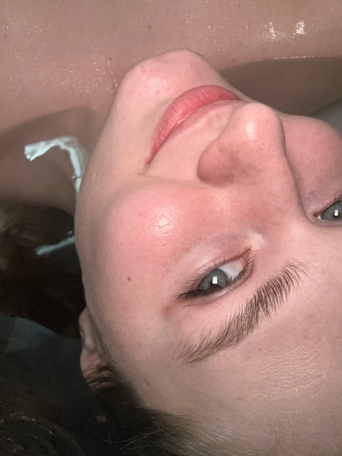 Woman documents personal care routine in Kazan bathroom