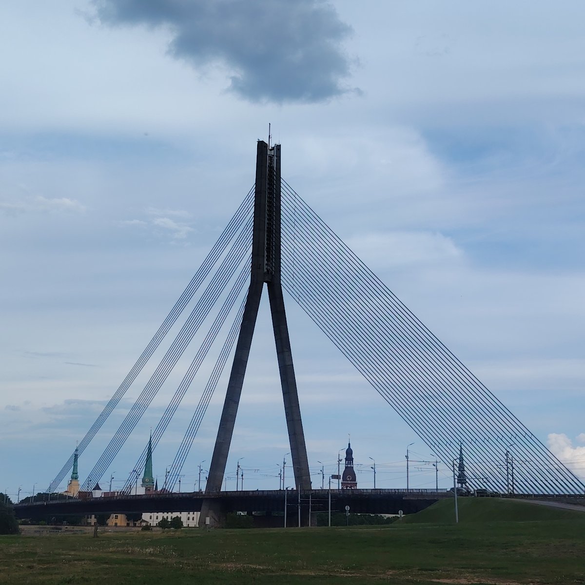Witness documents Riga waterfront landmarks during overcast afternoon