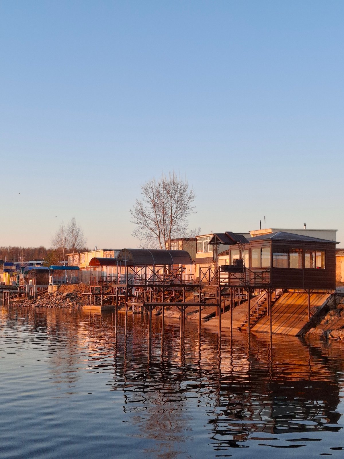 Sunset moments captured along Kama River waterfront in Chaikovsky