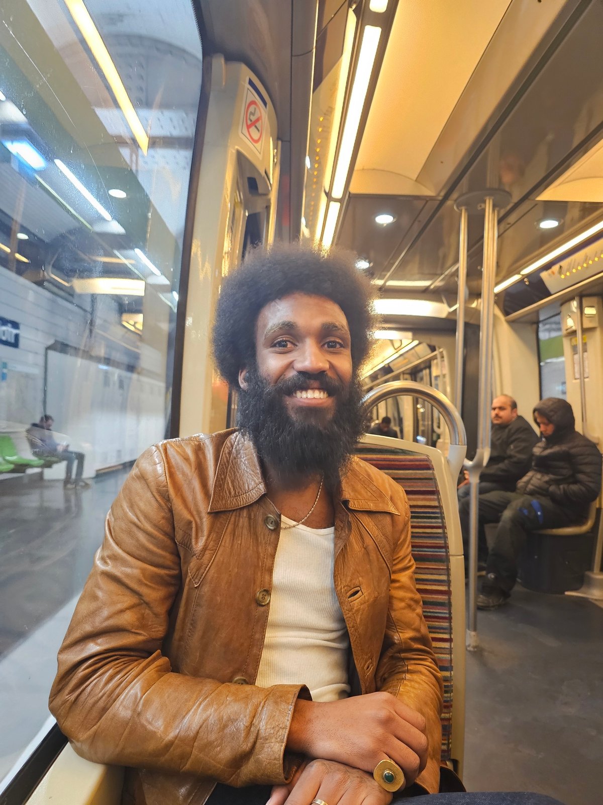 Late-night selfie captured on Paris Métro train