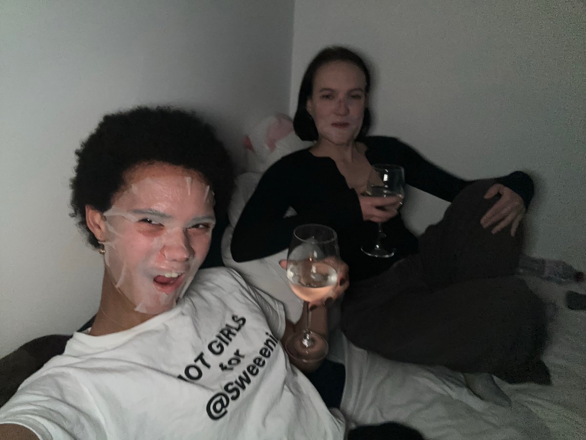 Women enjoy evening relaxation with skincare and projection display
