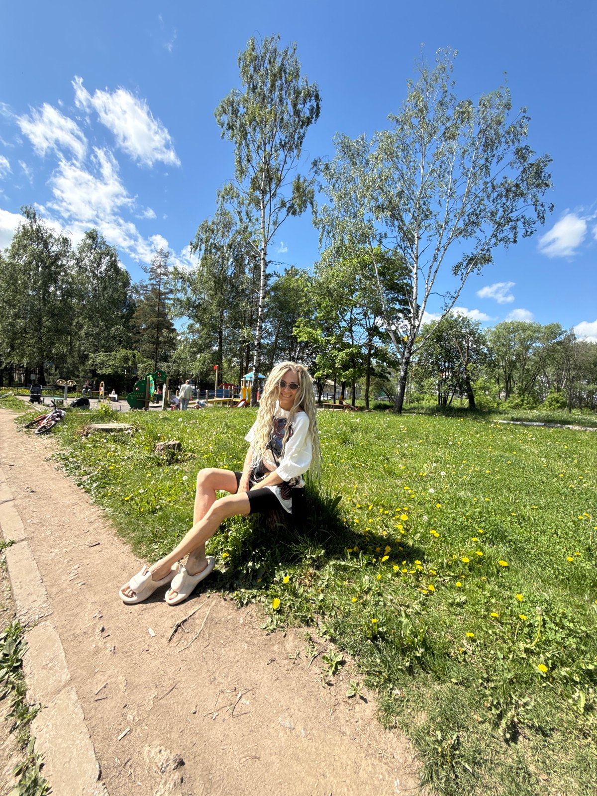 Woman enjoys morning park visit in Rusanovo, Russia
