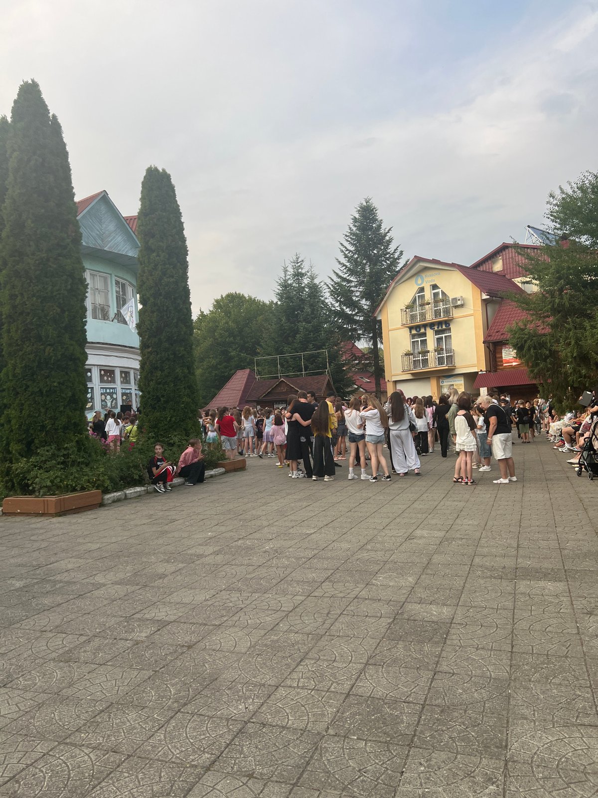 Outdoor gathering with dancing at a resort-style venue in Сонячне