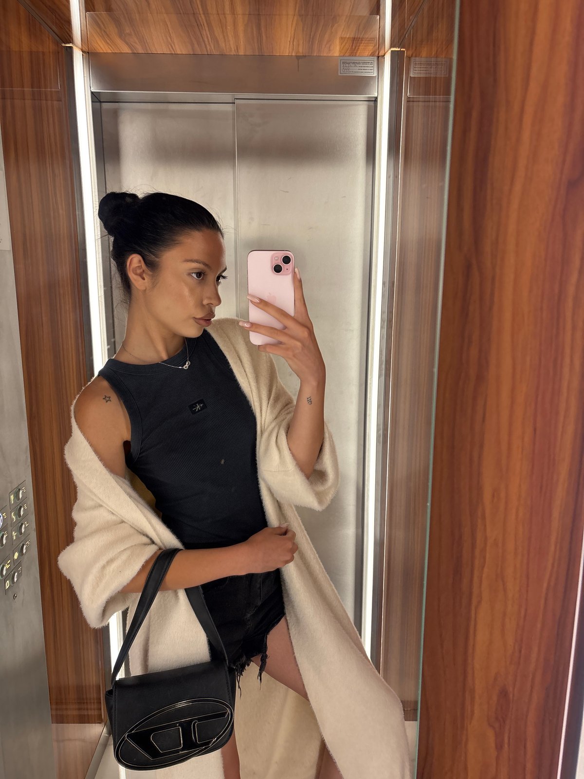 Elevator mirror selfie in Sofia, casual evening outfit.