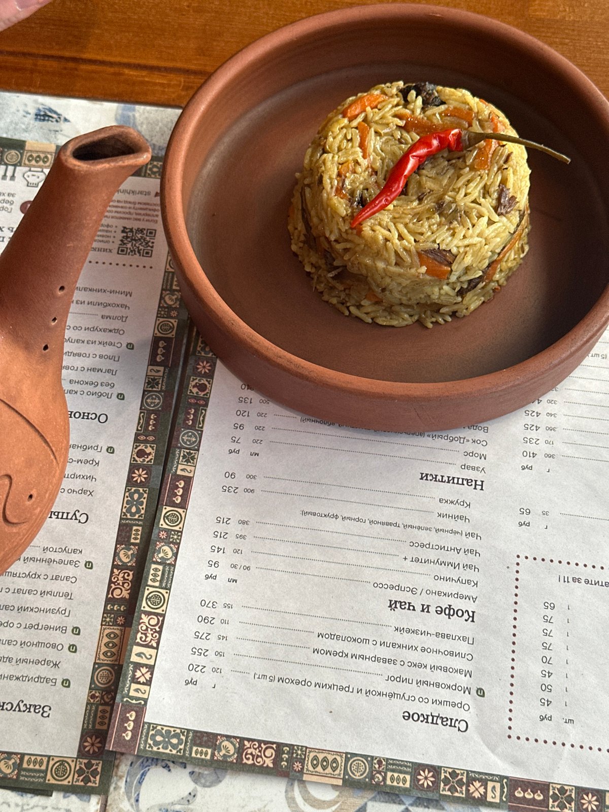 Woman dines on Georgian cuisine at Izhevsk restaurant