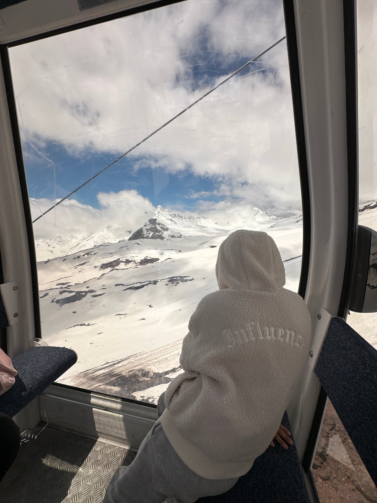 Gondola ride through snowy Terskol mountains, Russia