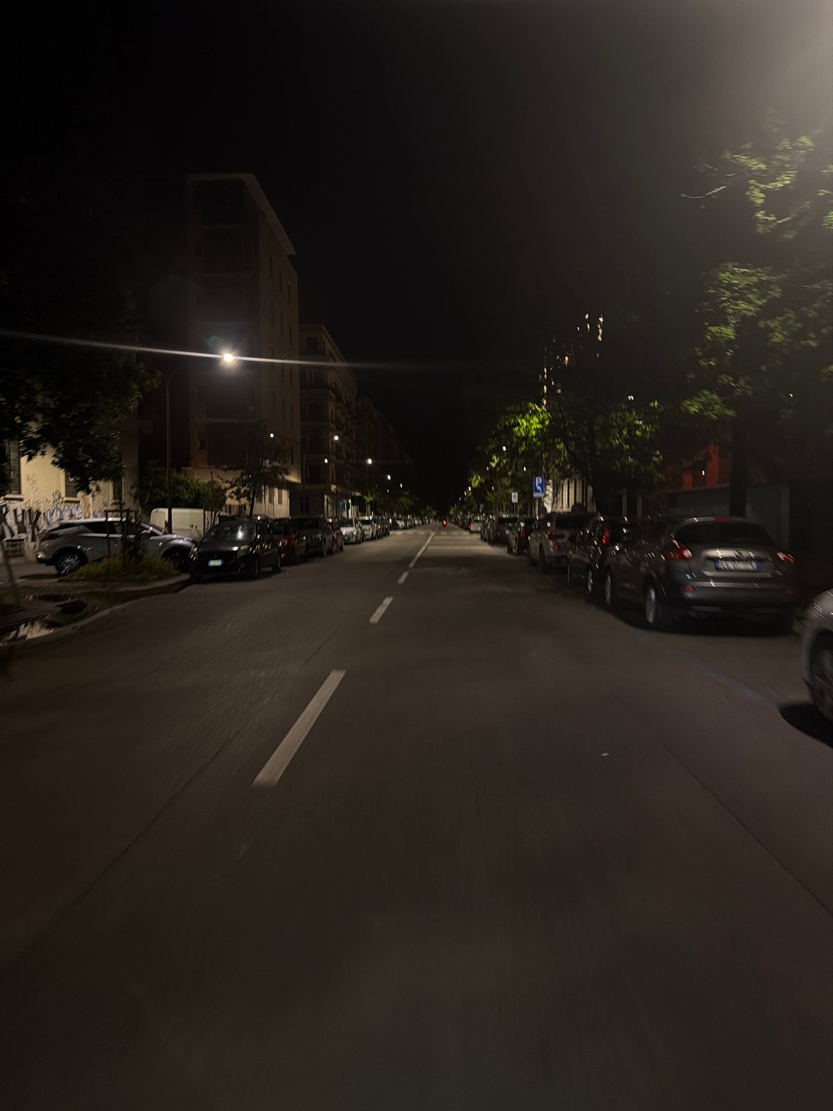 Quiet nighttime street scene captured in Milan