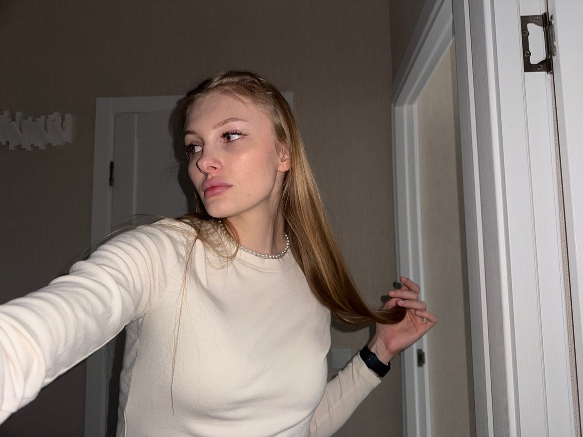 Woman documents selfie session in Perm, Russia apartment