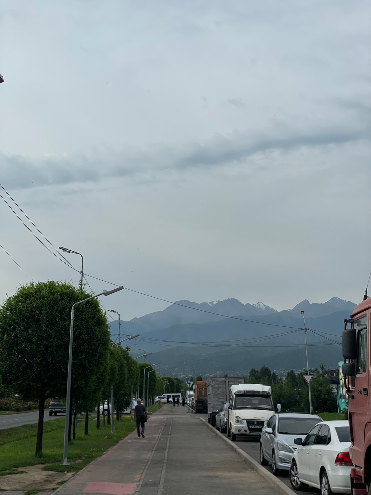 Street-level snapshots from Almaty with mountain backdrop