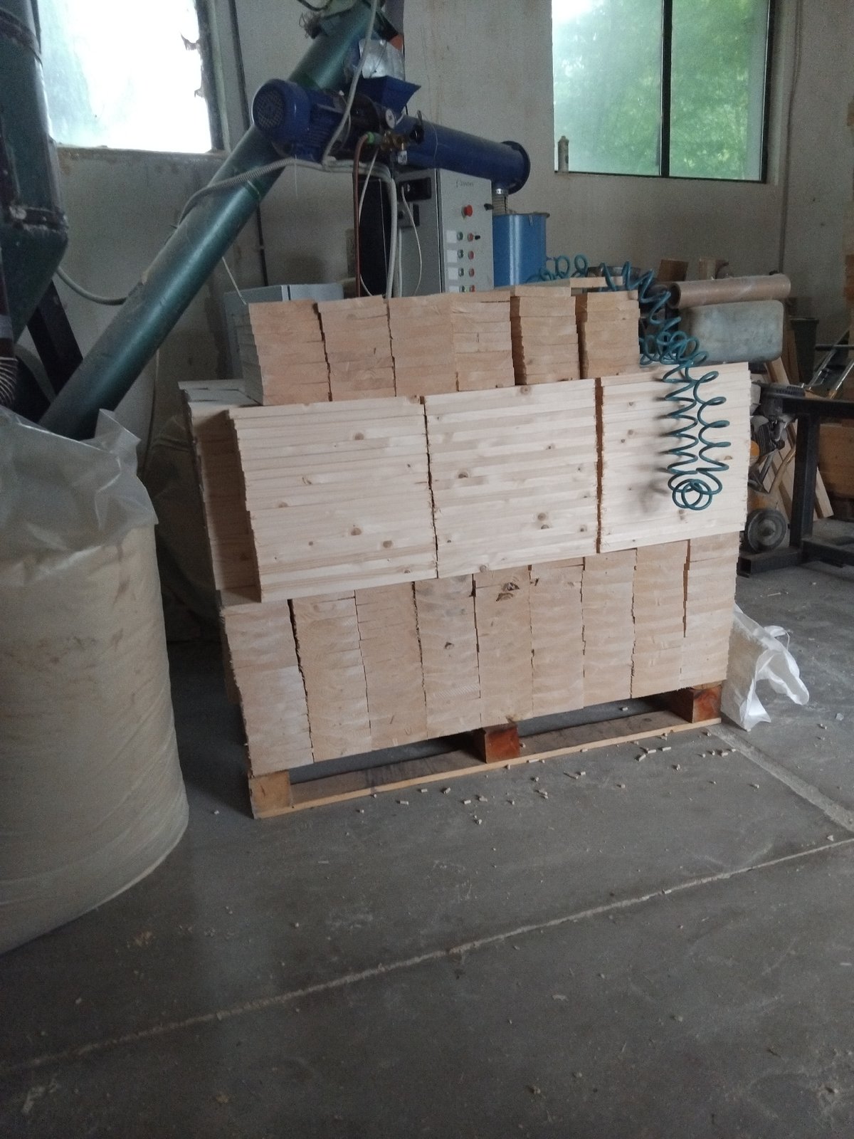 Lumber storage facility observed with stacked wood materials