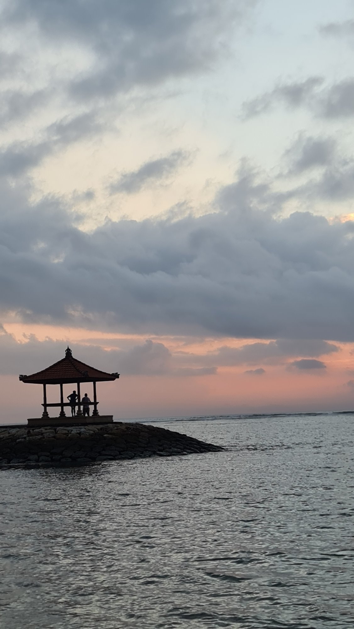 Dusk at Sanur Beach, Balinese gazebo on the water