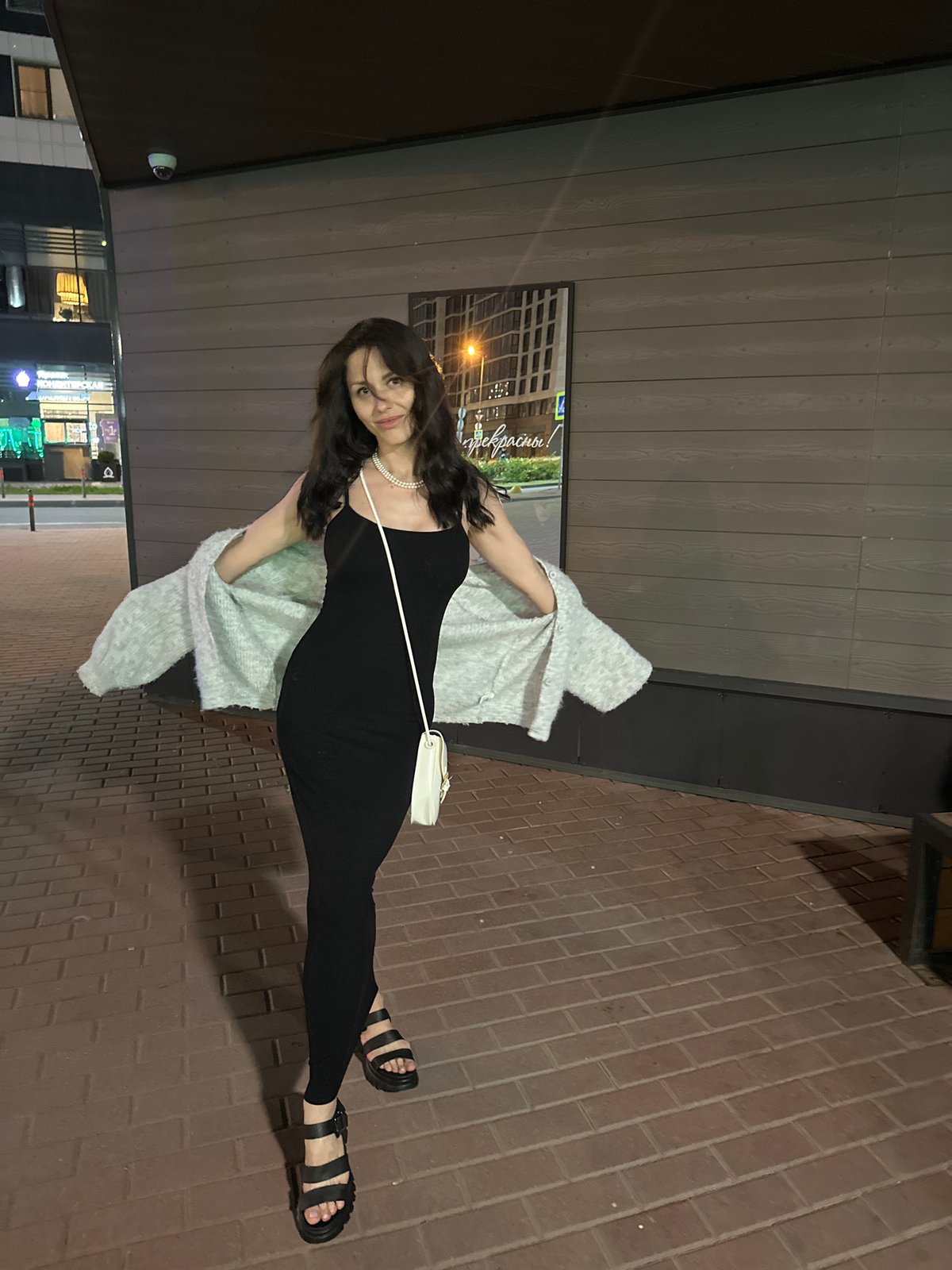 Woman poses for nighttime urban photo session