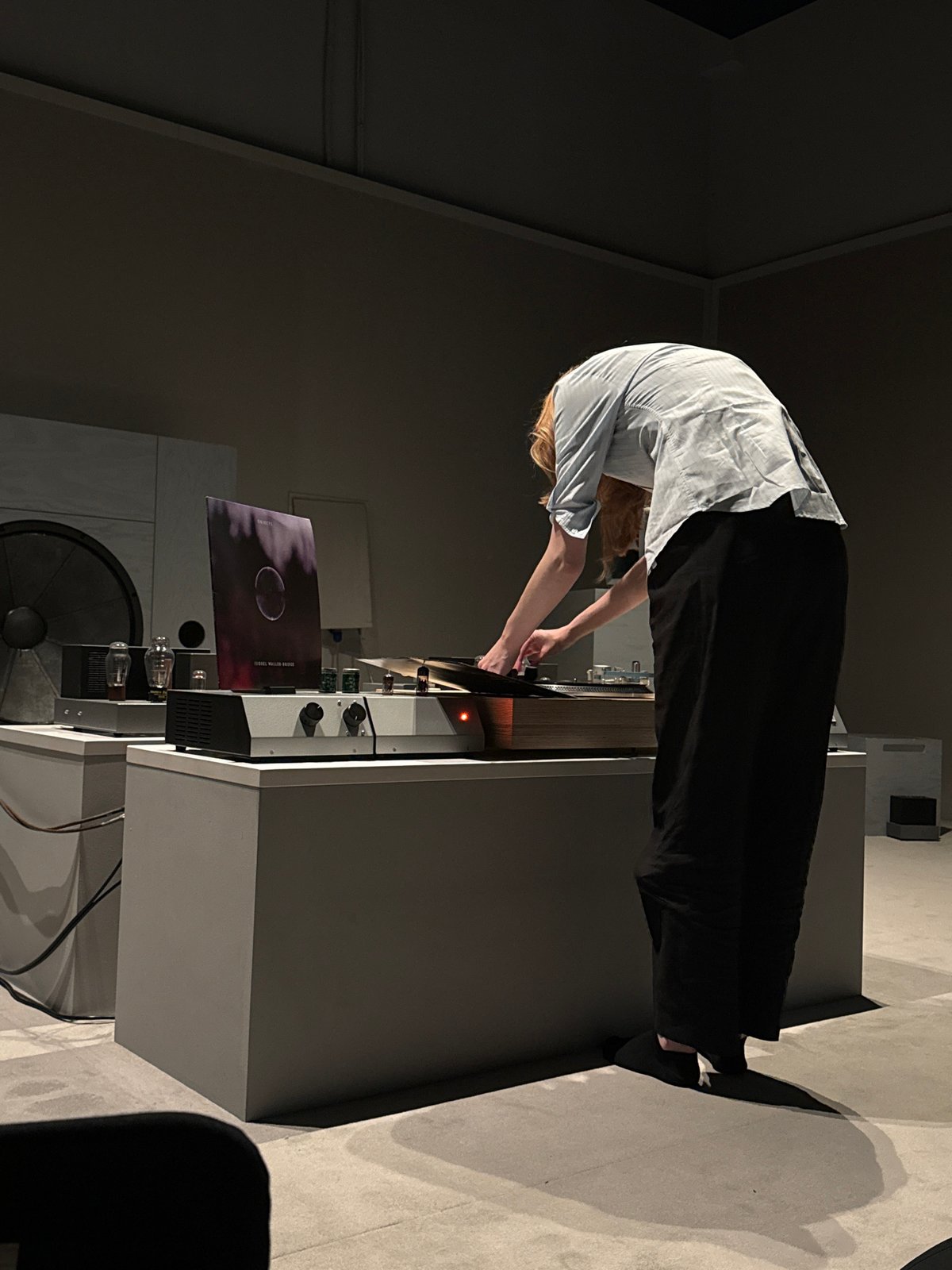 Person operates high-end audio equipment in London listening room