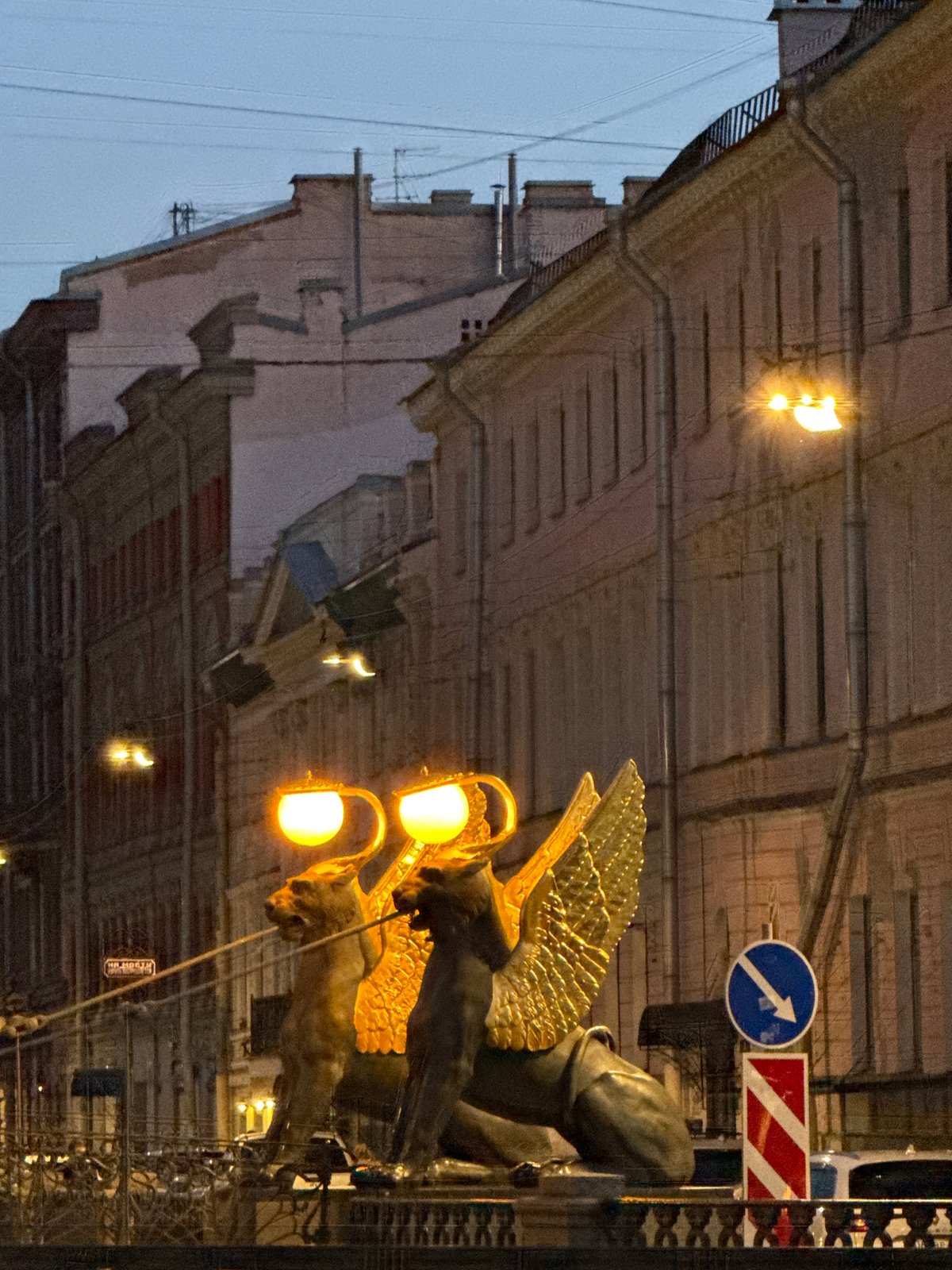 Woman documents evening stroll through historic Saint Petersburg landmarks