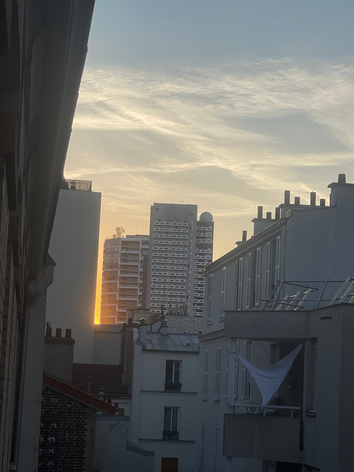 Paris rooftops at golden hour, with random desk-side snapshots