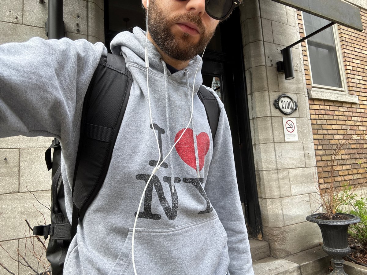 Man in NY-branded hoodie photographed on Montreal street