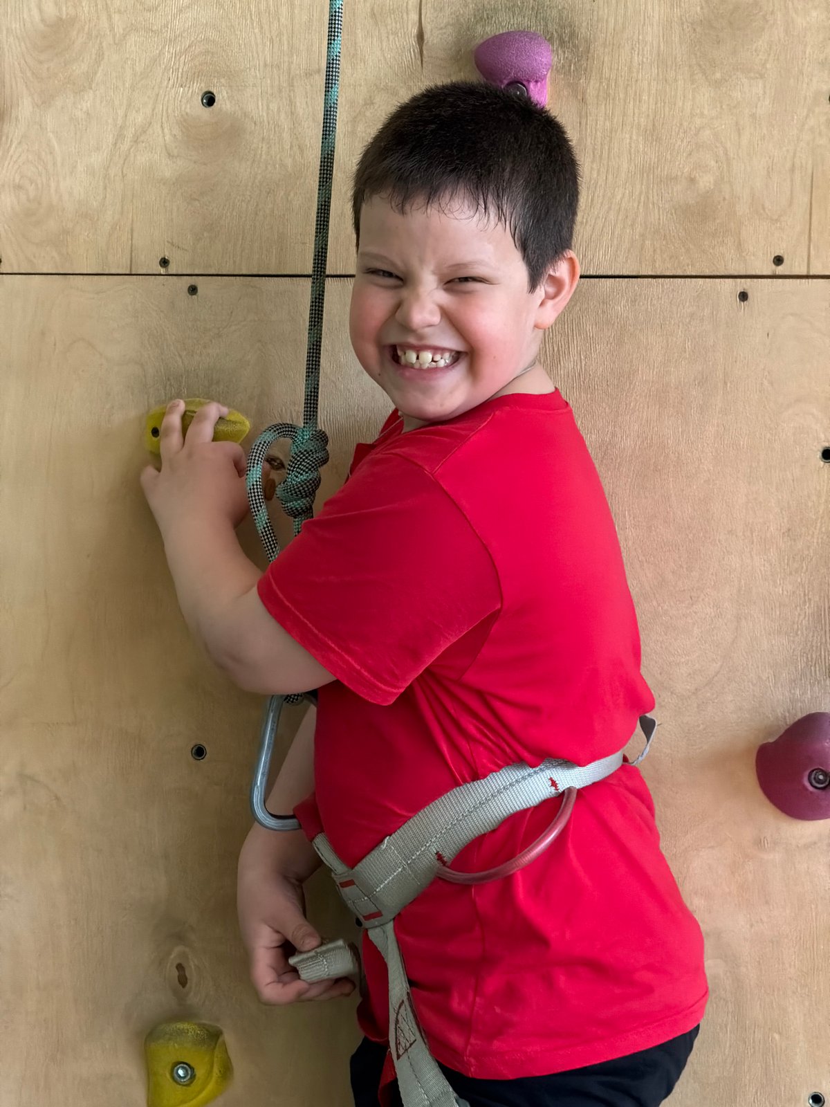 Children practice indoor rock climbing in Izhevsk facility