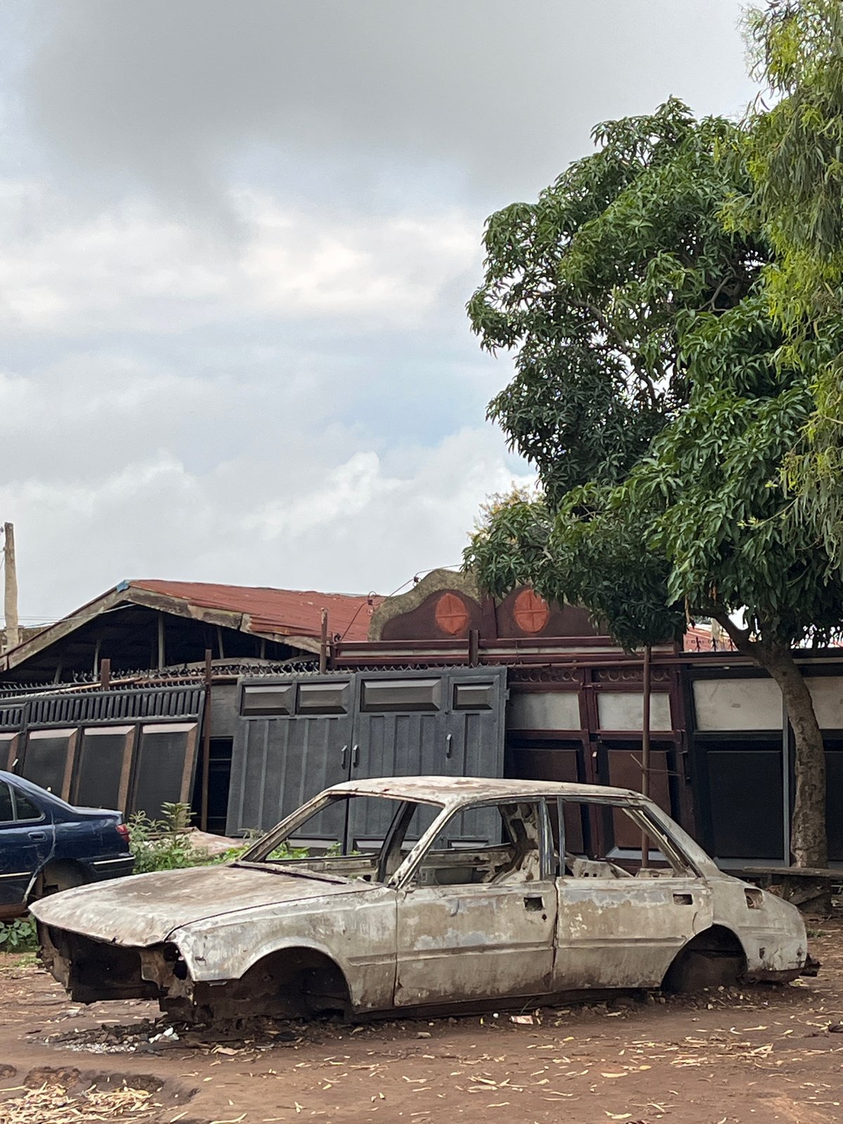 Bukuru streets at dusk: decay, infrastructure, and daily life