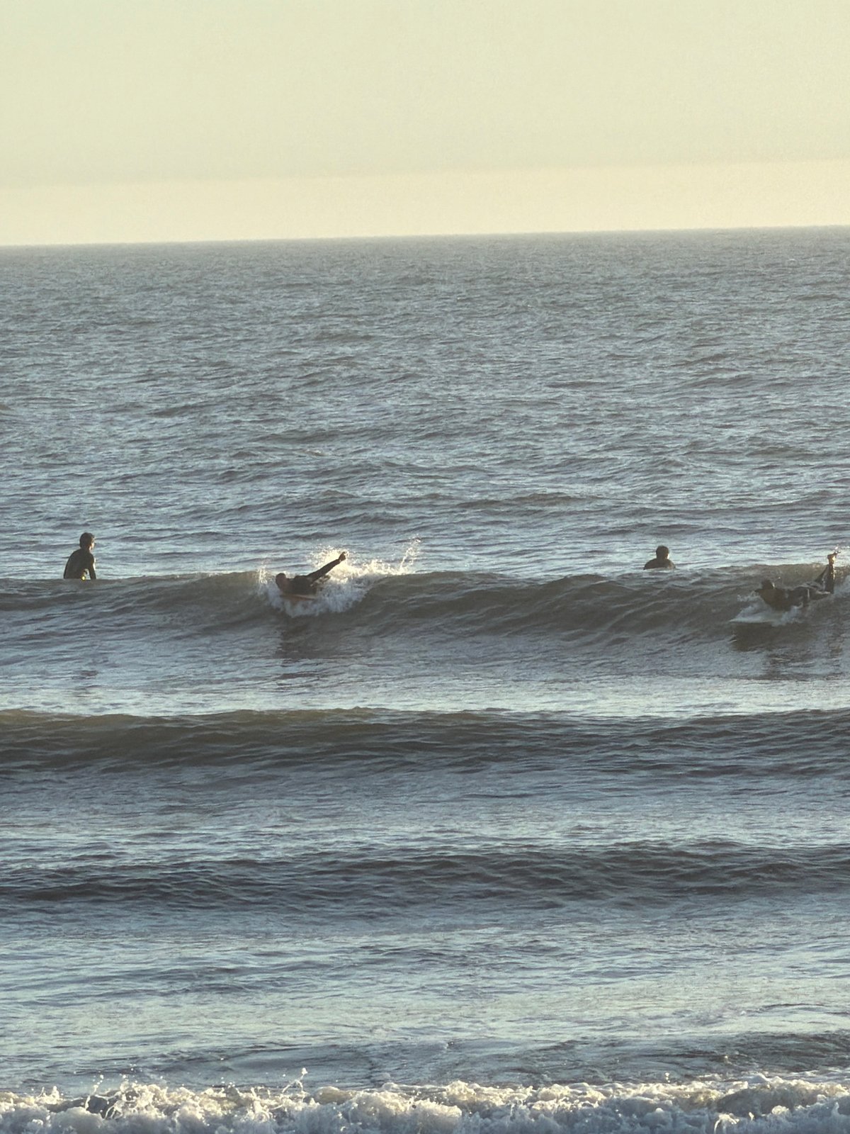Surfers and beachgoers captured along Espinho coastline
